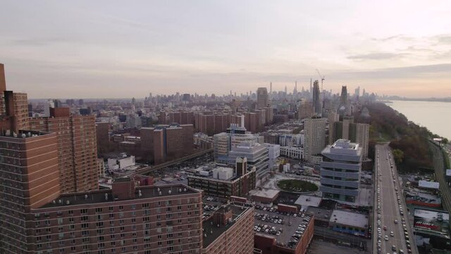 Long panoramic view of Manhattan, NYC skyline from Harlem. Housing projects