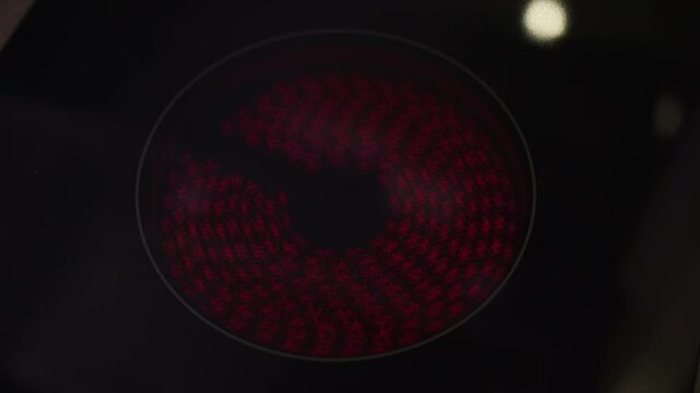 The ring of an induction cooktop, as the heating element turns on and off.