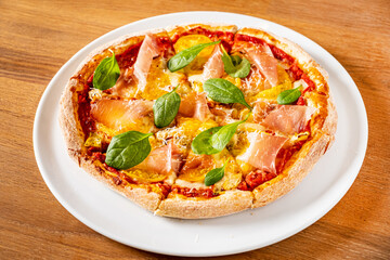 fresh pizza on the wooden background