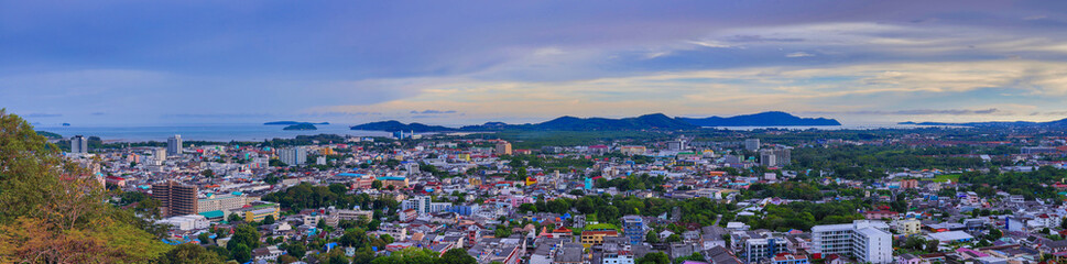 Fototapeta na wymiar Panoramic view old phuket town viewed from Khaorang Hill and in the distance is Challong Bay and the islands big Buddha and Rawai Phuket Thailand