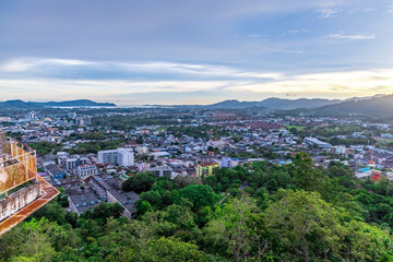 Fototapeta premium Panoramic view old phuket town viewed from Khaorang Hill and in the distance is Challong Bay and the islands big Buddha and Rawai Phuket Thailand