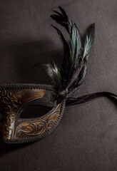 Carnival Venetian mask with feathers on black color background, female disguise, masquerade © Rawf8
