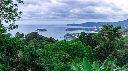 Fototapeta premium Kata Beach, Kata Noi beach Phuket with beautiful blues and Greens, turquoise oceans islands mountains boats trees and beautiful resort island of phuket thailand