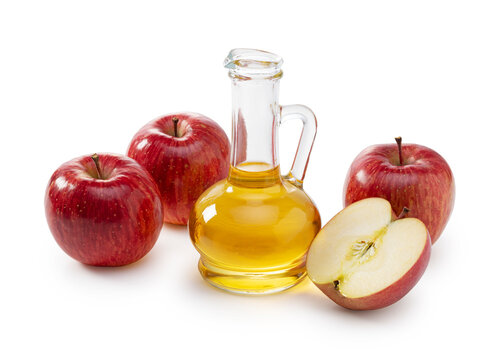 Apple vinegar in a glass container on a white background
