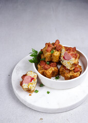 Tahu fantasi sosis or sarang burung is fried steamed tofu and top with sausages.