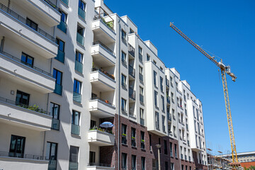 Modern apartment buildings with a construction crane seen in Berlin, Germany