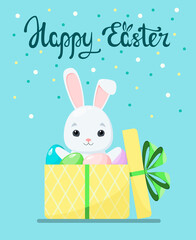 Happy Easter. A greeting card with a cute rabbit in a gift box with eggs. Cartoon design.
