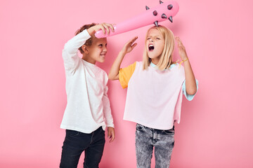 funny kids toy baton entertainment pink background