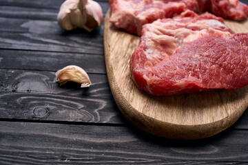 meat steak on wooden board ingredients top view food