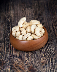 dried cashew nuts on a wooden table