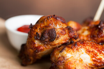 baked chicken wings together with ketchup