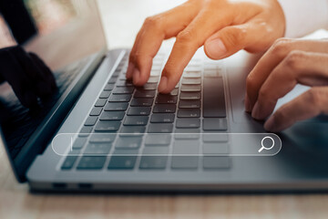 Businessman hands working with laptop computer, Searching browsing internet data information with blank search bar.