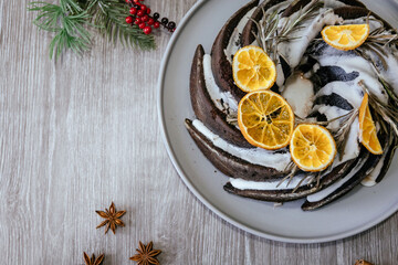 Christmas fruit cake, pudding on white plate. Copy space. Top view.