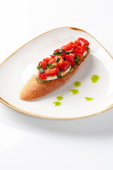 Bruschetta with tomato and basil salad, mozzarella and guacamole for breakfast