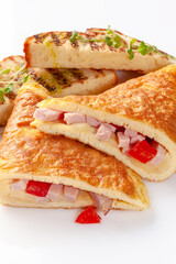 French omelette with ham, cheese and tomatoes served with toasts