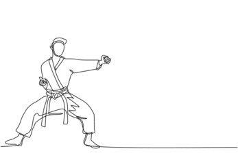 Single one line drawing young talented karateka man train with punch pose for duel fighting at dojo gym center. Mastering martial art sport concept. Modern continuous line draw design graphic vector © Simple Line