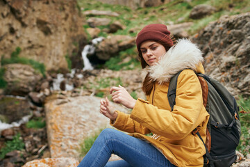 Naklejka premium woman hiker with backpack mountains travel adventure freedom