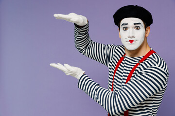 Charismatic amazing ecstatic young mime man with white face mask wears striped shirt beret hands...