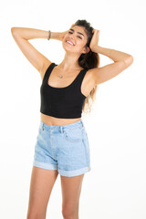 smiling slim girl brunette woman hand on hair in studio shot on white background