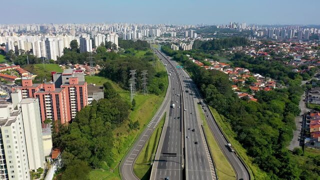 Aerial landscape of Bandeirantes highway road at countryside of Sao Paulo state Brazil. Landmark highway road between mountains. Rural landscape. Traffic at road. Brazilian freeway road.
