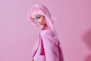 glamorous woman with pink wig posing luxury