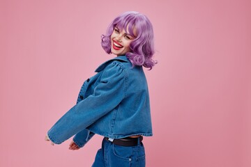 Positive young woman stylish clothes posing emotions cosmetics hairstyle studio model unaltered