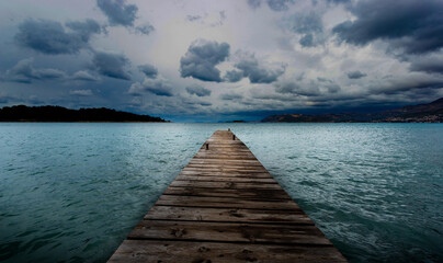 Wooden pier on the Adriatic sea. Stormy weather.