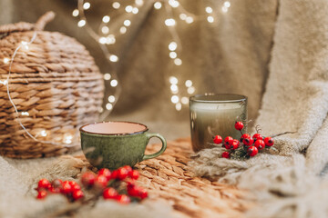 Obraz na płótnie Canvas evening tea party with Christmas lights hot tea and candy