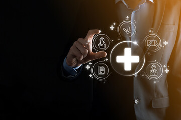 Businessman hold virtual plus medical network connection icons. Covid-19 pandemic develop people awareness and spread attention on their healthcare.Doctor,document,medicine,ambulance,patient icon.