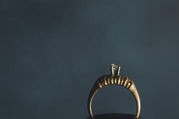 Black and white close up on diamond ring on dark back drop
