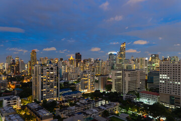 Obraz premium Aerial view of Sathorn, Bangkok Downtown. Financial district and business centers in smart urban city in Asia. Skyscraper and high-rise buildings at night.