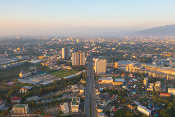 Aerial view of Chiang Mai Downtown Skyline, Thailand. Financial district and business centers in smart urban city in Asia. Skyscraper and high-rise buildings at sunset.