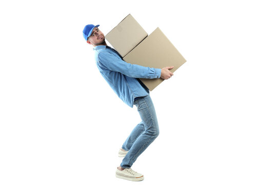 Delivery man holds heavy boxes, isolated on white background