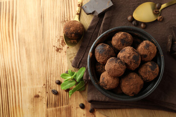 Concept of sweets with truffles on wooden background