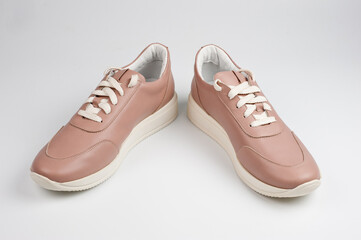 Light brown faux leather shoes with laces. Close-up shot.