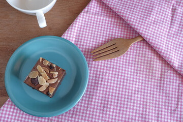 Fresh brownies in small dish on table. Delicious chocolate pie.