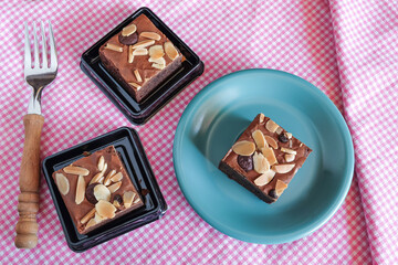 Fresh brownies in small dish on table. Delicious chocolate pie.