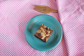 Fresh brownies in small dish on table. Delicious chocolate pie.