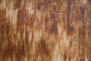 Fototapeta premium Rust metal surface. Texture of a rusty metal surface with remains of white paint applied with vertical chaotic brush strokes, high resolution.