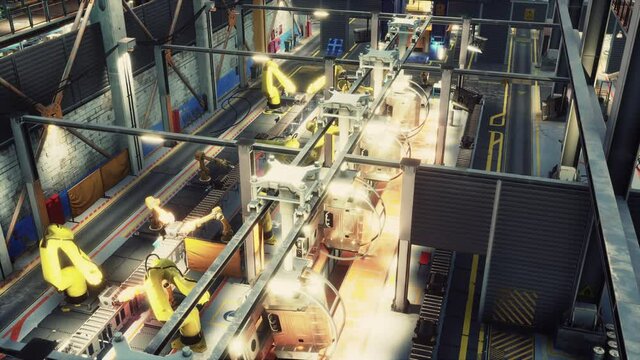 robotic arms in a car factory
