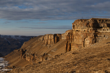 Fototapeta na wymiar Layered rocks in the sunset rays. Plateau Bergamet