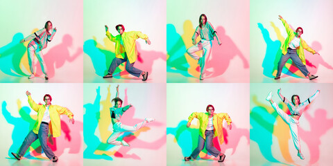 Two stylish girls, teens dancing hip-hop in stylish clothes on colored studio background with glitch effect.