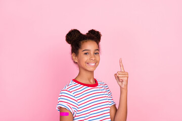 Photo of african american brunette childhood girl stylish trendy casual wear model point immunization isolated on pink color background