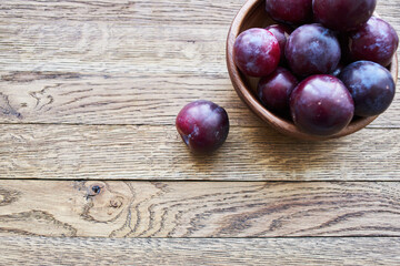 plums fruits natural products on a wooden table top view