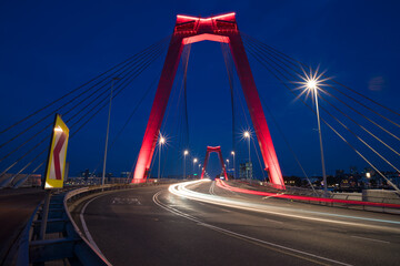 Fototapeta na wymiar red illuminated Willems Bridge in Rotterdam