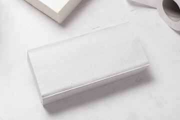 Set of different paper hand towels on wooden desk