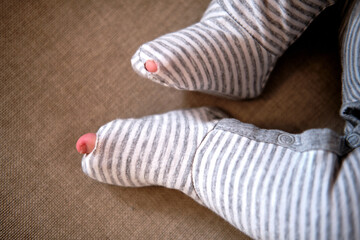Baby clothes with a hole in the foot