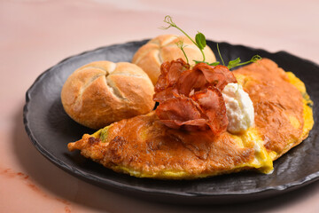 Breakfast omelette with ricotta cheese and bacon