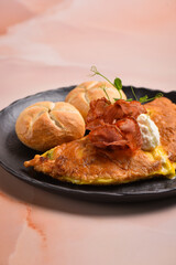 Breakfast omelette with ricotta cheese and bacon