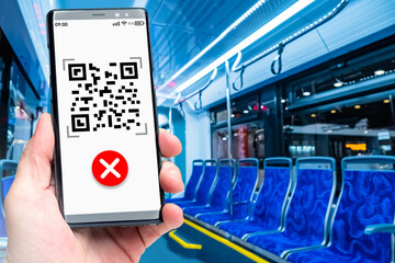 Prohibition of travel in transport without a QR code. A smartphone with a QR code and a red...